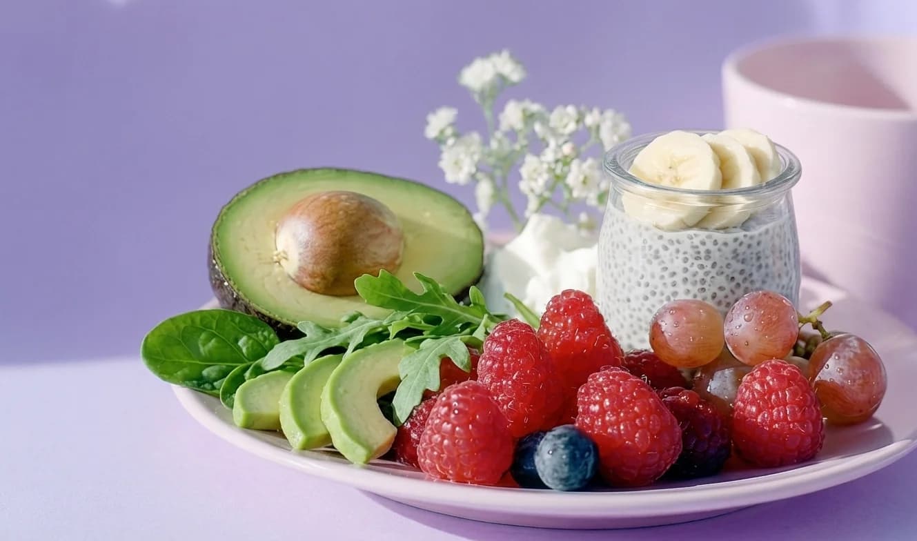 Breakfast plate with avocado, berries, and chia pudding